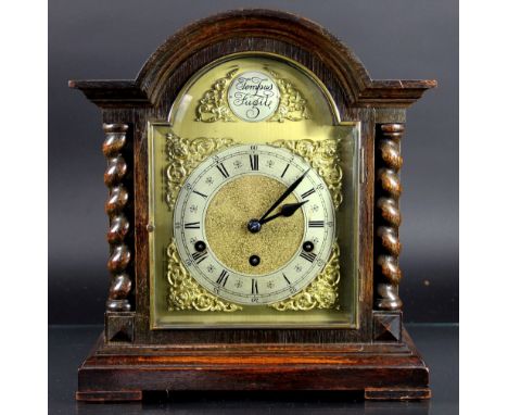 A 1920's oak mantel clock, with Roman numeral chapter ring and movement striking on five straight gongs, 37cm