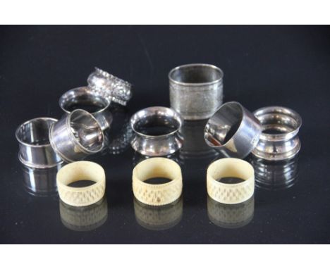 A set of twelve pairs of silver plated fish eaters, in original mahogany case, four silver napkin rings, an Indian white meta