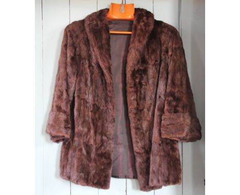 A Lady's three quarter length mink fur coat, with a similar stole and hat, coat 55cm (3)