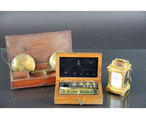 A set of 19th century brass travelling scales and weights, in mahogany box 20cm, a part set of micro weights, a S & A Caldera