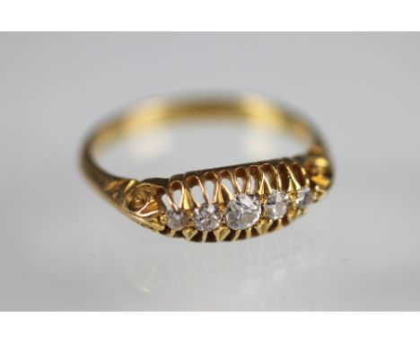 A Victorian five stone diamond ring, the five graduated old cut diamonds, all claw set within boat shaped setting, scroll car