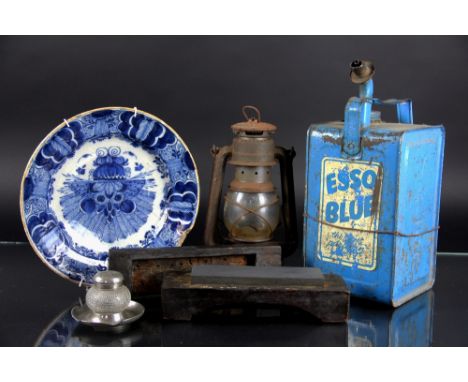 An 18th century Delft tingled earthware dish, decorated with a vase of flowers (at fault), 26.5cm, with an Esso Blue petrol c