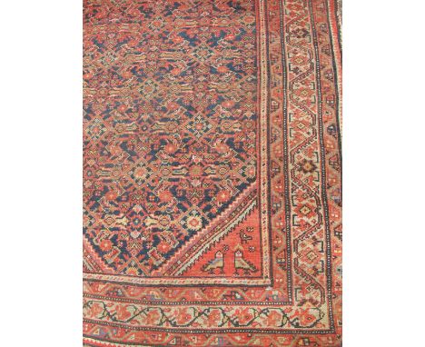 An Eastern design runner, in blue and red with birds to the spandrels, 192ins x 44ins 