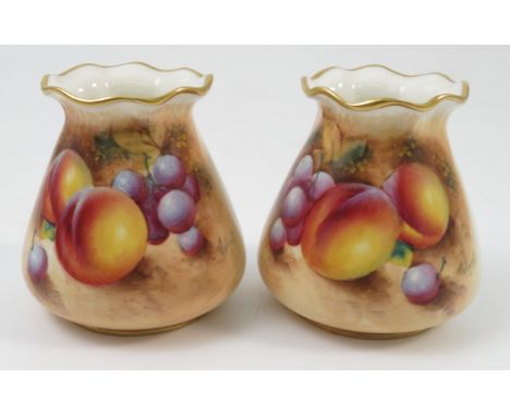 A pair of Royal Worcester vases, of tapering cylindrical form, with flared necks, decorated half round with hand painted frui