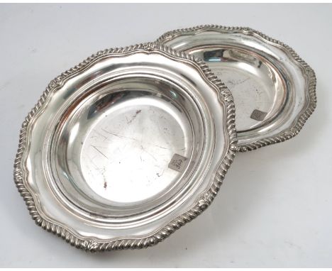 Six silver plated bowls, with gadrooned shaped edge, diameter 10ins, together with a silver plated fiddle pattern ladle, a wh