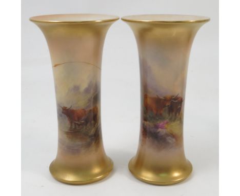 Two Royal Worcester trumpet shaped vases, with gilt edges, hand painted with Highland cattle in landscape, by H Stinton and J
