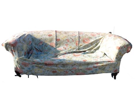 A two seat Chesterfield sofa, raised on short turned legs, width 78ins 