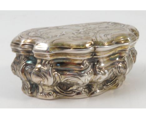 A 19th century continental silver gilt snuff box, of shaped form with embossed figure and scroll decoration, width 2.75ins