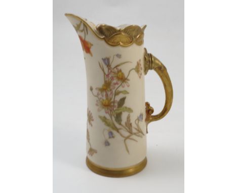 A Royal Worcester gilded ivory jug, decorated with floral sprays in polychrome colours, to a moulded and gilded neck and hand