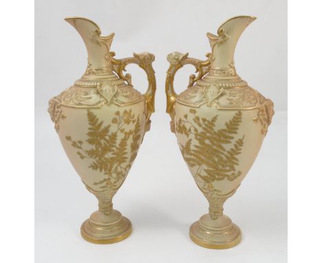 A pair of blush ivory Royal Worcester ewer, with moulded decoration and gilt fern deign, shape number 1742, dated 1896, af, h