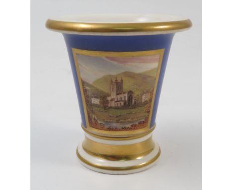 A 19th century Doe and Rogers spill vase, of flared trumpet form decorated with a blue ground with reserve panel of Malvern P