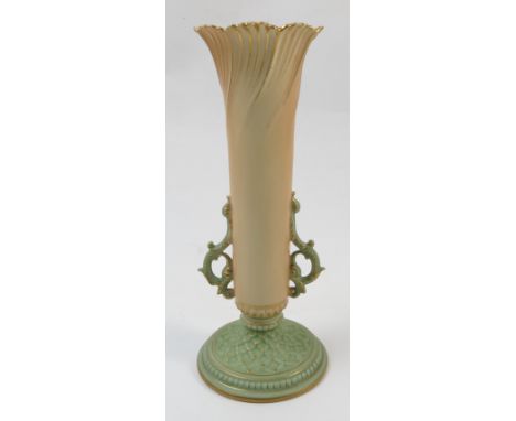 A Royal Worcester blush ivory flower holder, of slender tapering form to green handles and lattice moulded circular stepped f