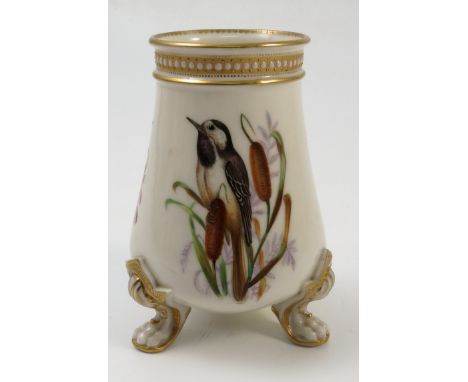 A Royal Worcester vase, of tapering form, decorated with birds and foliage to a jewelled and gilded border, raised on three p