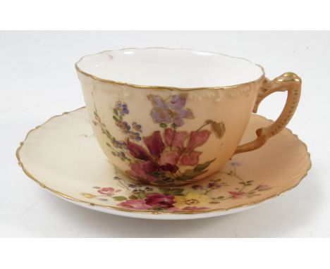 A Royal Worcester blush ivory cup and saucer, printed painted with floral sprays, dated 1918