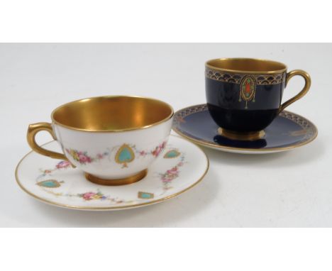 Two Royal Worcester cabinet cups and saucers, one with turquoise jewelling and floral swags to a white ground the other with 