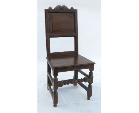 A North Country chair, with fielded panel back, solid seat and raised on turned legs 