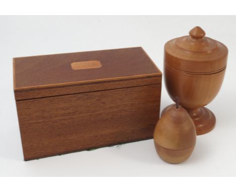 G.E.S. Jones, a mahogany tea caddy, of rectangular form, with stringing and plaque marked TEA, stamped to interior, width 7.5