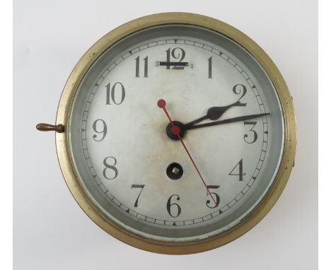 A circular brass cased ship's clock with silver dial, second hand sweep, dial with approximately 5.5 ins