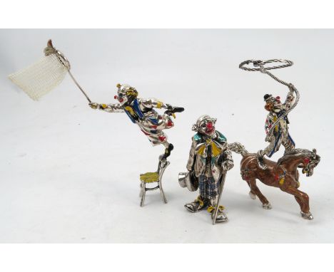 Three modern silver clown models, to include one on horseback, one with walking stick and one balancing on a chair, all with 