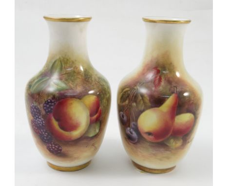 Two similar Royal Worcester vases, decorated half round with hand painted fruit to a mossy background, by D Bowkett, dated 19