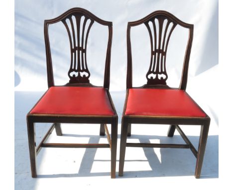A set of six Chippendale design dining chairs, with pierced splats, raised on square legs united by stretchers