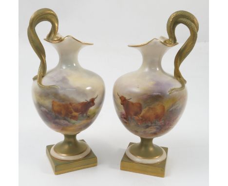 A pair of Royal Worcester ewers, decorated with hand painted Highland cattle in a landscape, by H Stinton, to green and gilt 