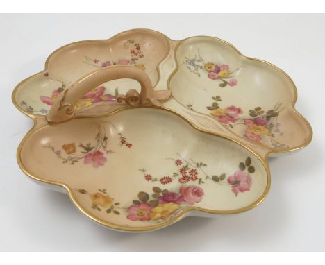 A Royal Worcester blush ivory hors d'oeuvre dish, with hoop handle and three trays, shape number 1994 circa 1905, diameter 10