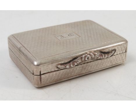 A Georgian silver vinaigrette, with engine turned decoration and engraved with initials, flower embossed clasp, the pierced g