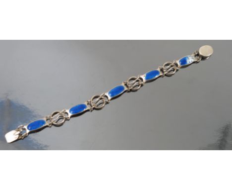 An Art Nouveau silver and enamel bracelet, by Smith and Ewen, marks worn but probably Birmingham 1909, the rectangular panels