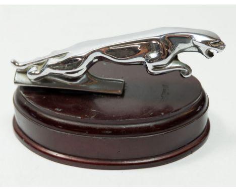 A vintage Jaguar chrome car bonnet mascot mounted on wooden base, 12.5cm long 