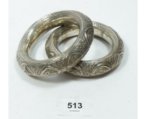 A pair of vintage Middle Eastern white metal bangles 