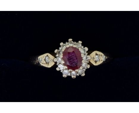 A gold ring (unmarked) set ruby and diamond cluster, size N to O 