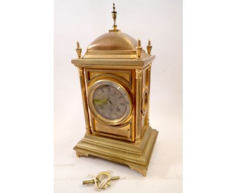 A 19th century Benson's gilt metal architectural style mantel clock with panelled case flanked by pillastas, 34cm tall 
