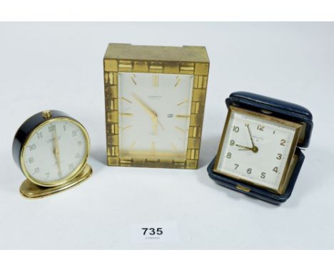 Two Looping eight day alarm clocks, fifteen jewels and a Swiza eight day travel clock (3) 