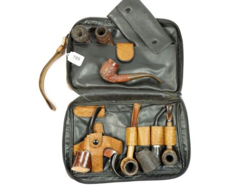 A vintage leather smokers compendium case by Caracciola West Germany, to include pouch, cleaners and eight vintage pipes 