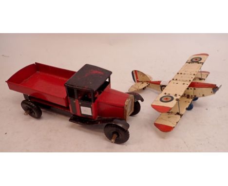 A painted metal toy truck, 49cm and a painted model metal aeroplane, 47cm wingspan 
