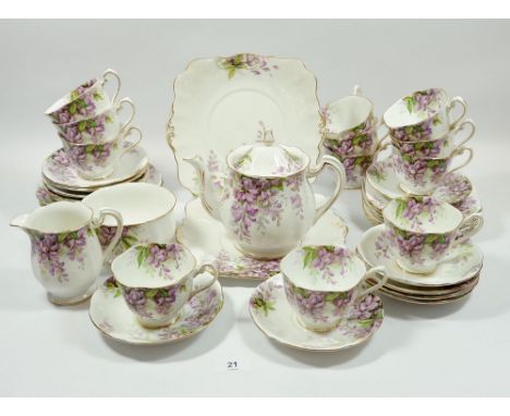 A Royal Standard Wisteria tea service comprising: twelve cups and saucers, twelve tea plates, teapot, milk and sugar, 