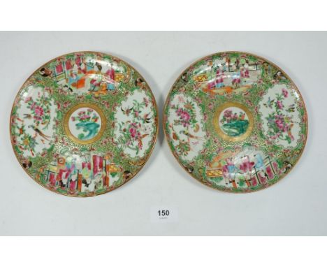A pair of Canton plates with floral and figurative panel decoration, 20cm diameter 