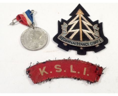 A Reconnaissance Corporals  fabric badge, Two Kings Shropshire Light Infantry shoulder badges and a commemorative medal 1911 