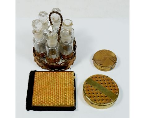 An Art Deco Nilde compact, another compact, a mirror and a miniature set of six Rimmel Ltd perfume bottles in stand, one a/f 