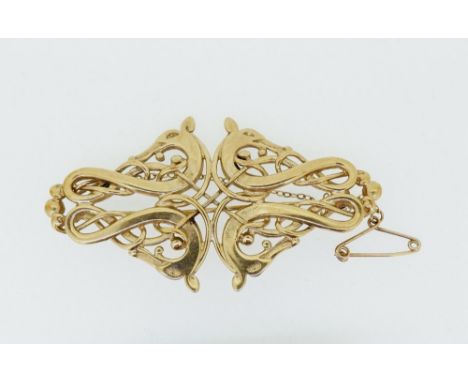 An Ola Gorie Celtic 9 carat gold openwork dragon brooch, 11g 