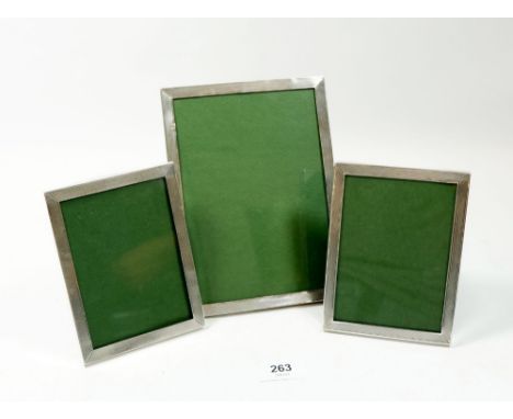 A set of three silver engine turned photograph frames Birmingham 1950, 1958 and 1954, 19 x 14cm and 2 x 13.5 x 10cm 