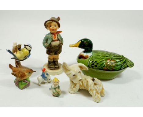 A group of china figures to include a Hummel 'Brother' figure, a blue tit CV64 1962, Royal Worcester wren, Michel Caugant duc