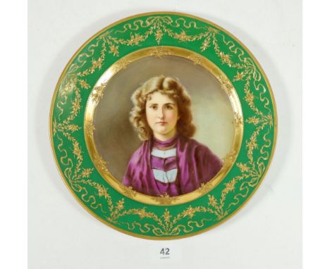 A Vienna plate painted portrait of a young woman in green and gilt border, 24.5cm 