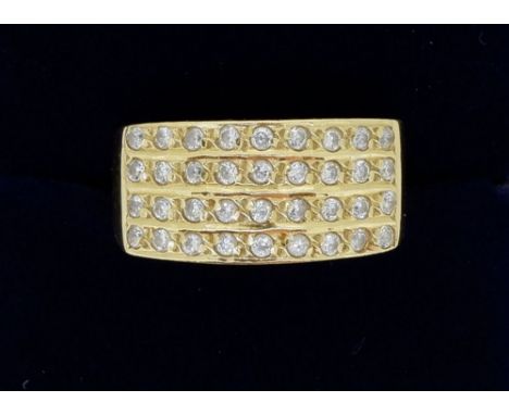 An 18 carat gold ring set panel of white stones, size M, 4g 