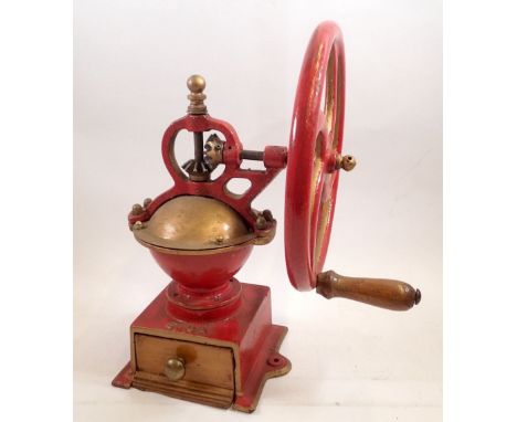 A red painted Elma coffee grinder 