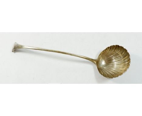 A Georgian silver shell bowl ladle - marks rubbed, 164g, 32cm long 