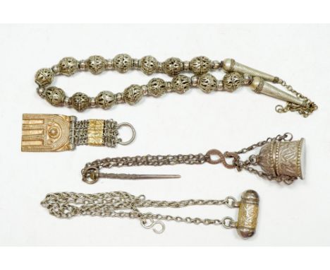 A Middle Eastern vintage white metal pierced beaded necklace, a Koran holder necklace and a kohl pot pendant etc. 