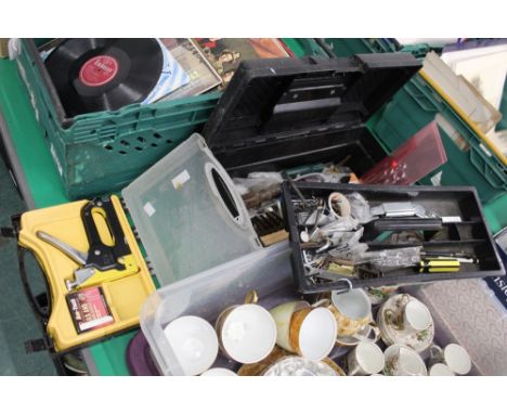 A staple gun and a tool box of hand tools 