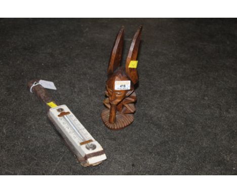 Ethnic carving and 19th century mounted thermometer